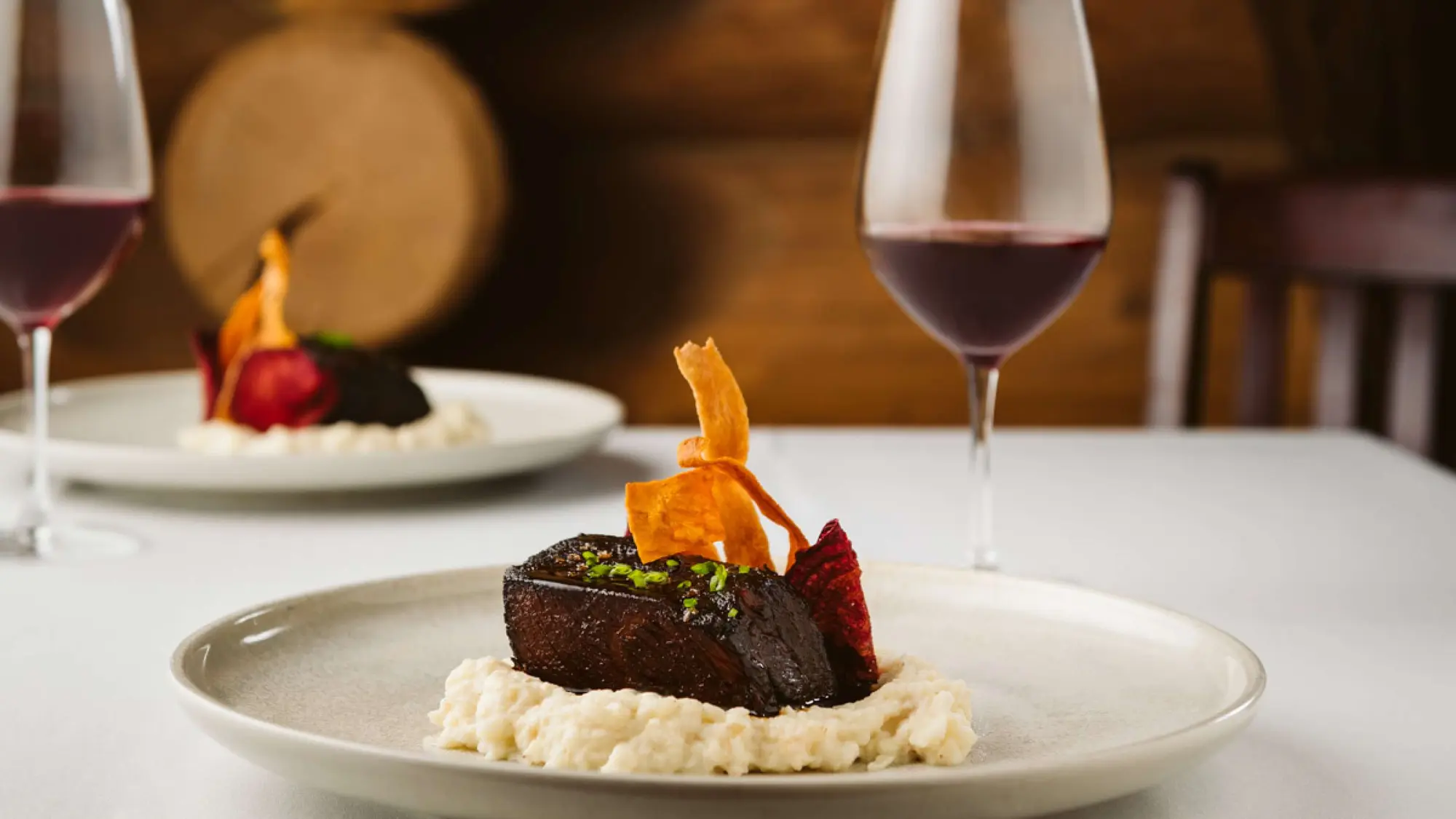 A plated Island Lake dinner, with red wine