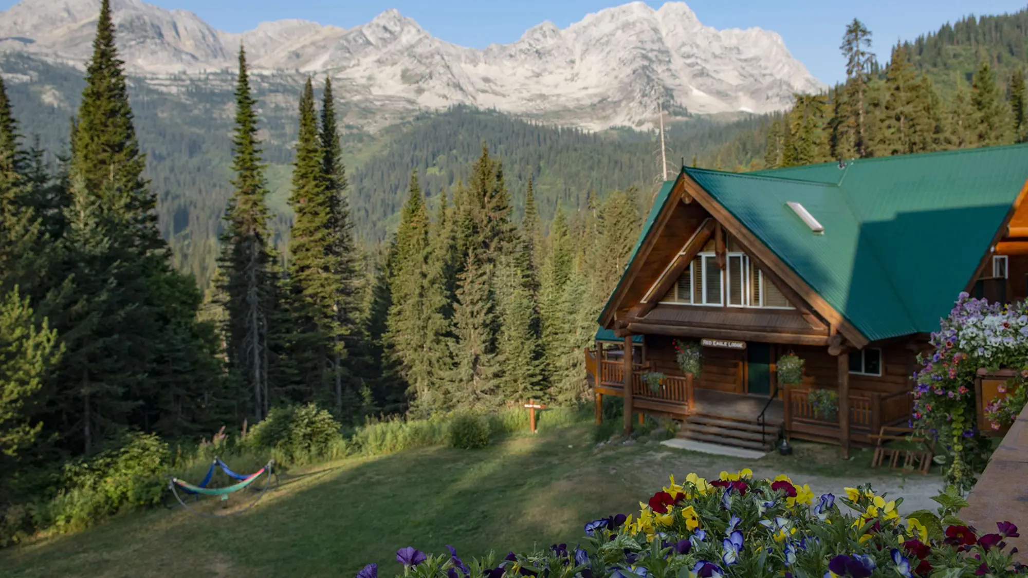 Red Eagle Lodge beneath the summer peaks