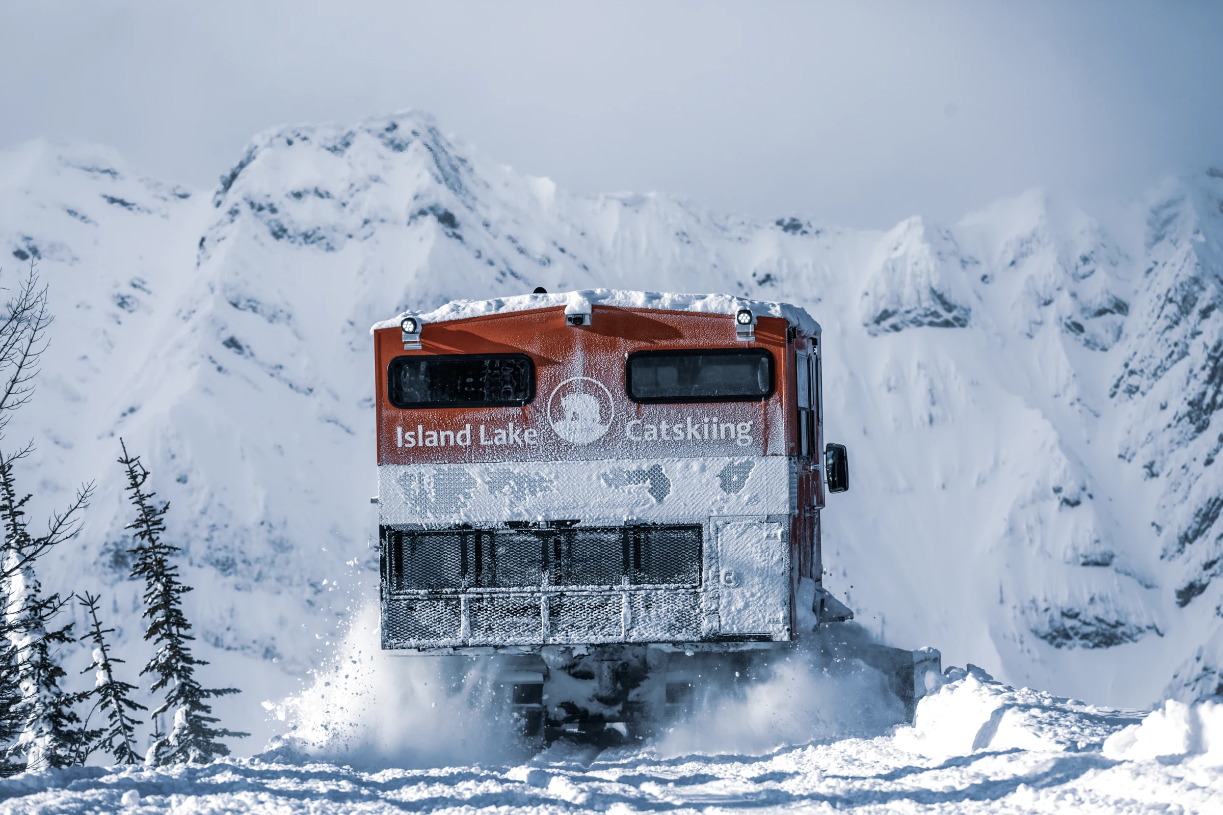 An Island Lake snowcat travelling through the forest