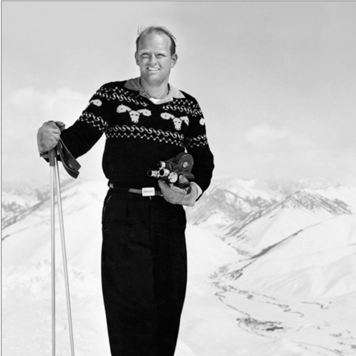 Warren Miller with a film camera · Photo courtesy of the Warren Miller Archive